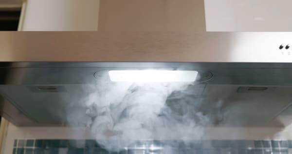 A close-up of steam filtering into a range hood - iStock Credit: PonyWang